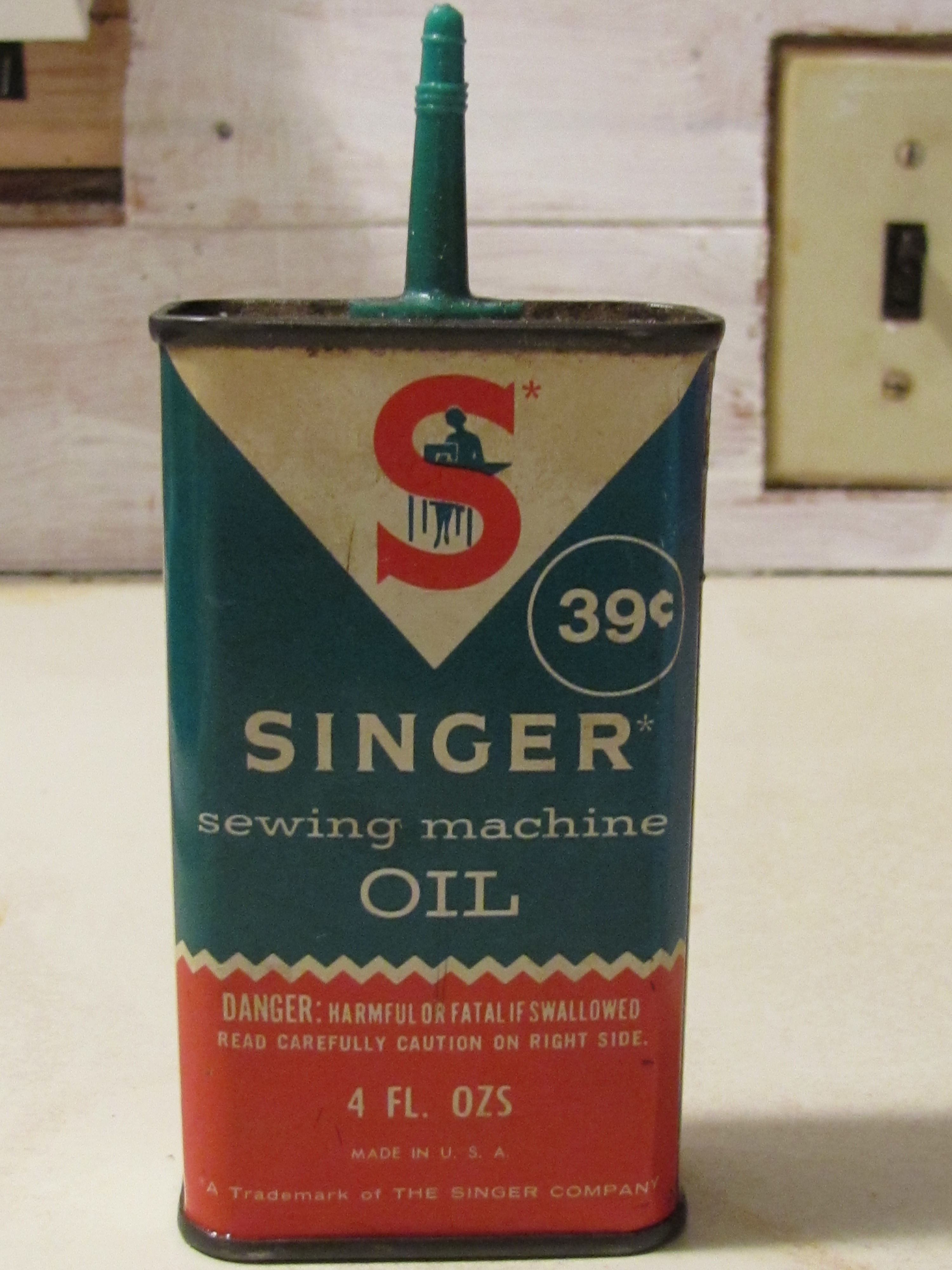 singer tin oil can