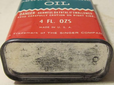 singer tin oil can